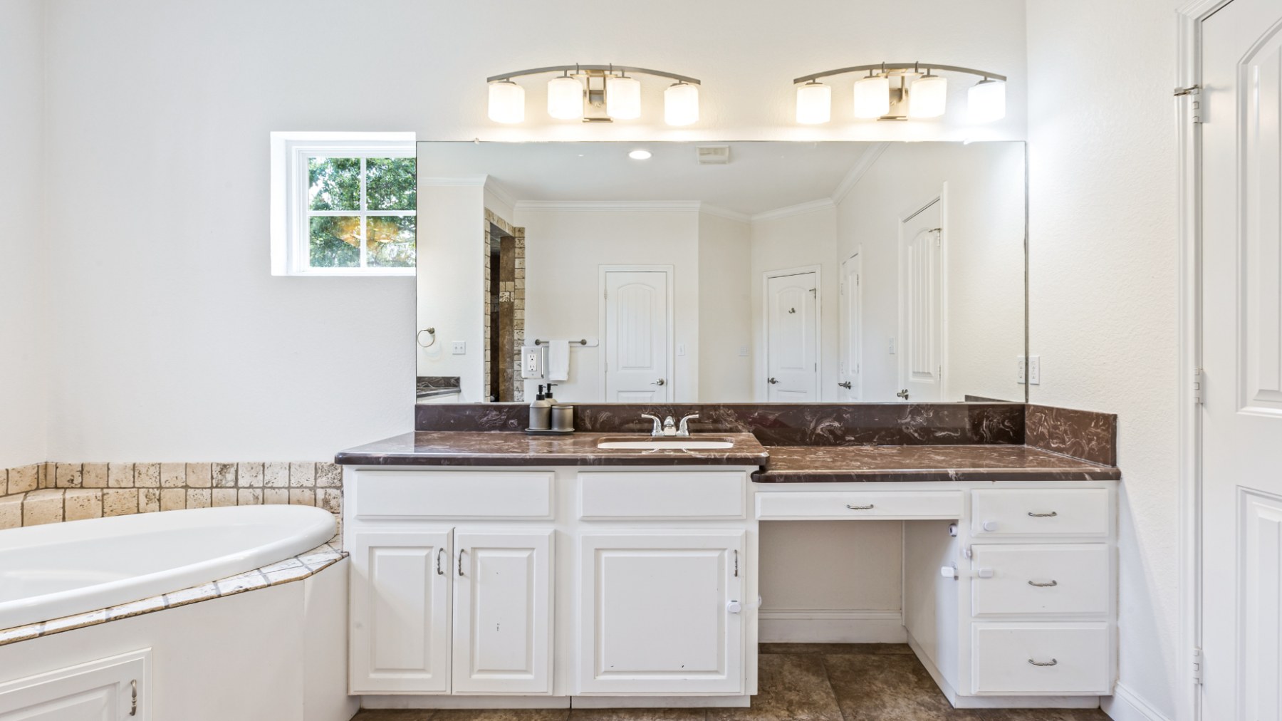 a kitchen with a sink and a refrigerator